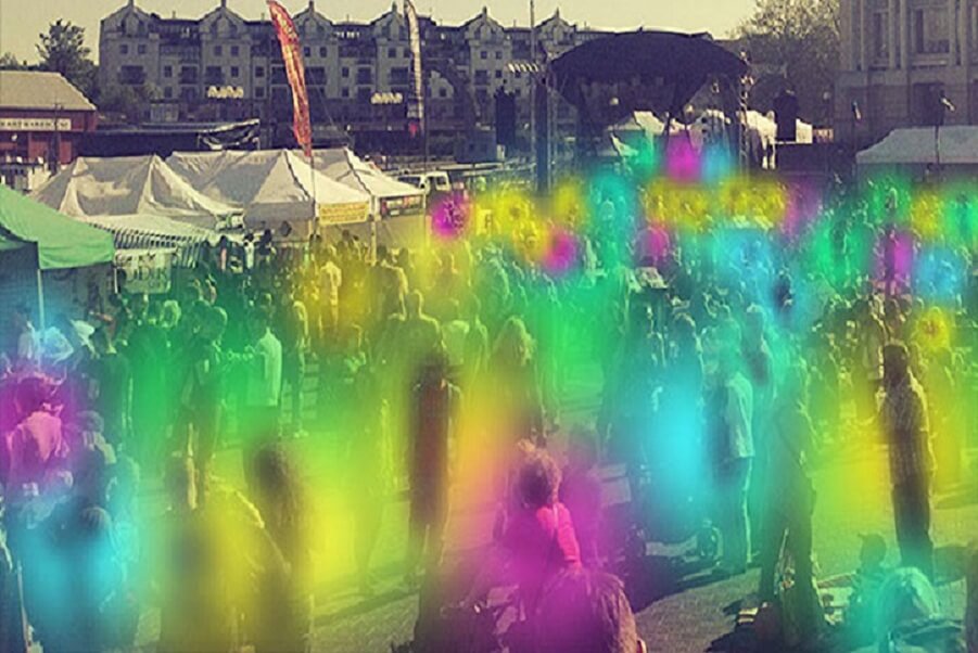 Colorful human aura fields glowing in a crowd during energy healing or aura photography event