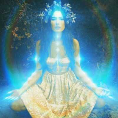 Woman surrounded by glowing blue aura energy during an aura healing meditation