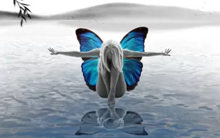 Woman with butterfly wings kneeling over water, symbolizing spiritual awakening