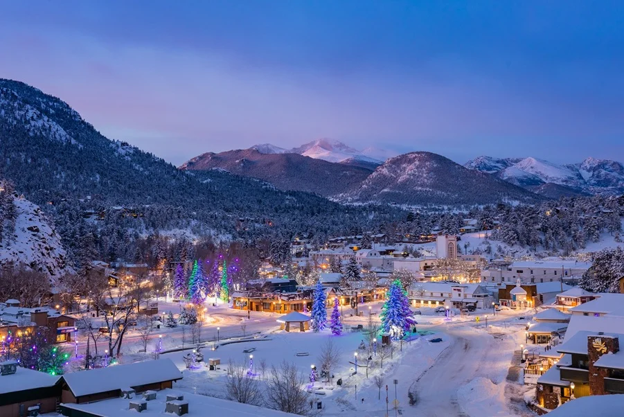 Winter wonderland view of Estes Park with mountain backdrop
