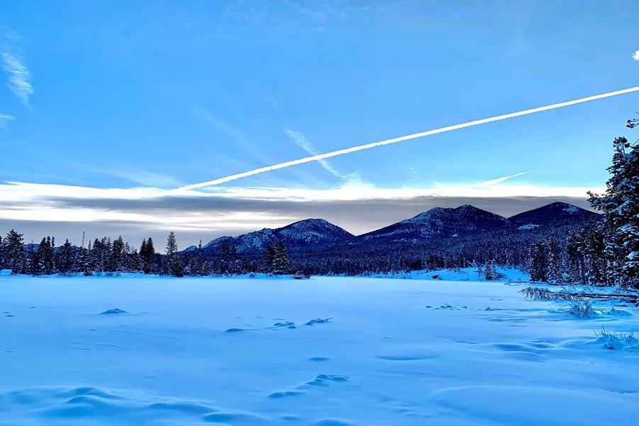 Full moon over snowy mountains near South Park, Colorado