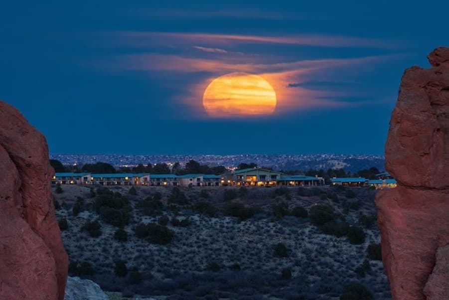 Supermoon rising over Garden of the Gods symbolizing powerful full moon energy Photo by Zach Vogel