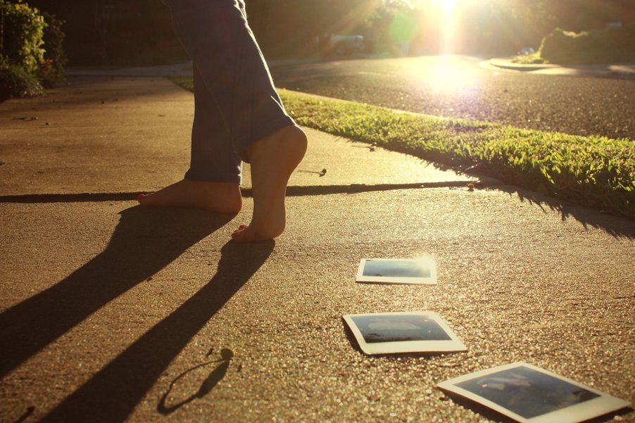 Woman walking barefoot away, symbolizing letting go of a relationship and moving forward.