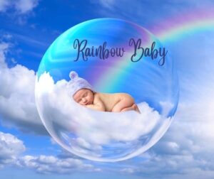 Angelic child surrounded by white feathers and rainbow light symbolizing a spirit baby/rainbow babies.