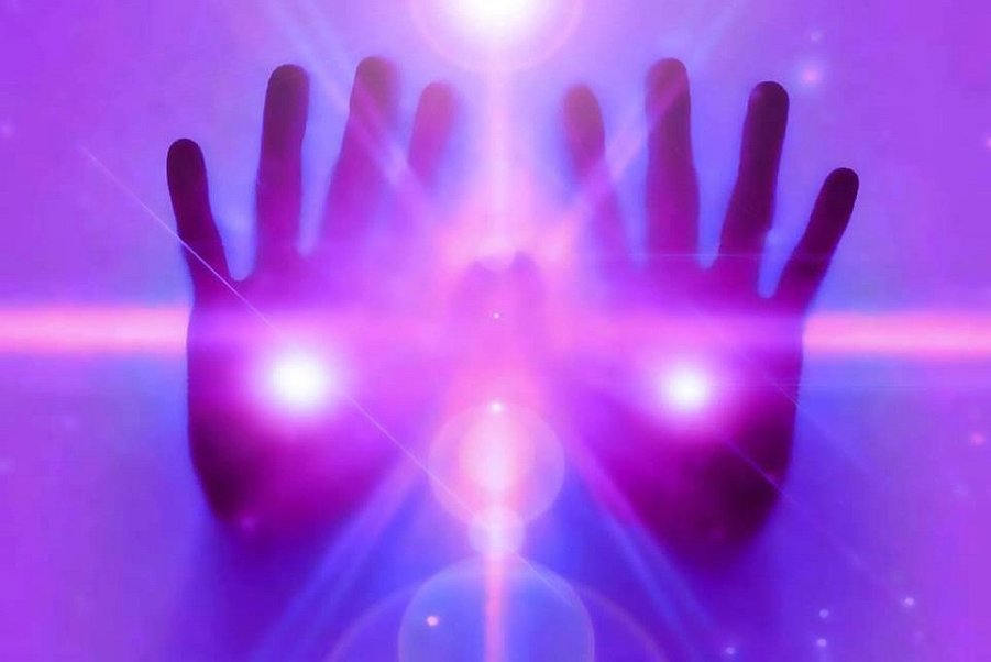Remote Reiki healing hands radiating universal energy with Psychic Lilly