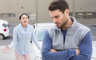 Man walking away from woman in conflict, symbolizing relationship imbalance