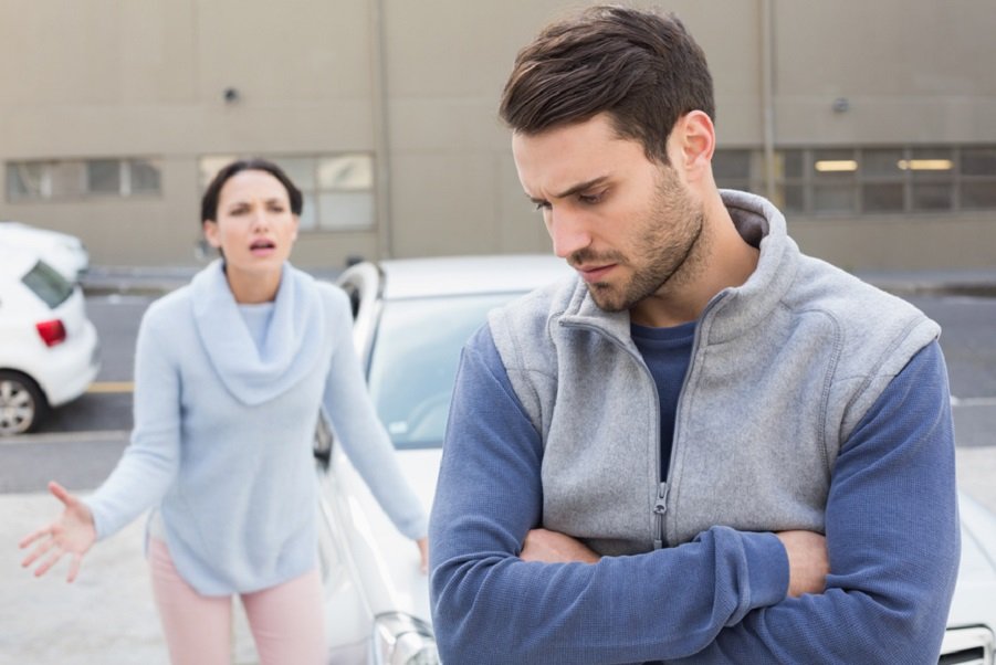 Man walking away from woman in conflict, symbolizing relationship imbalance