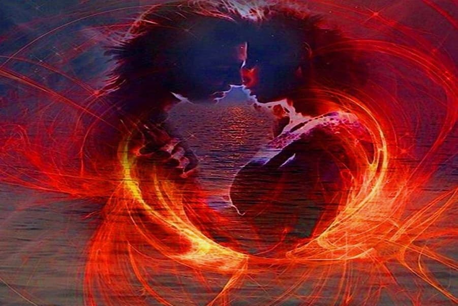 Twin flame couple glowing in red aura of soulmate energy