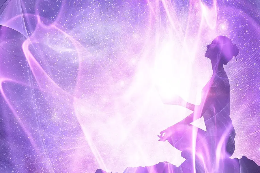 Woman meditating in violet flame healing energy light for spiritual cleansing and transformation